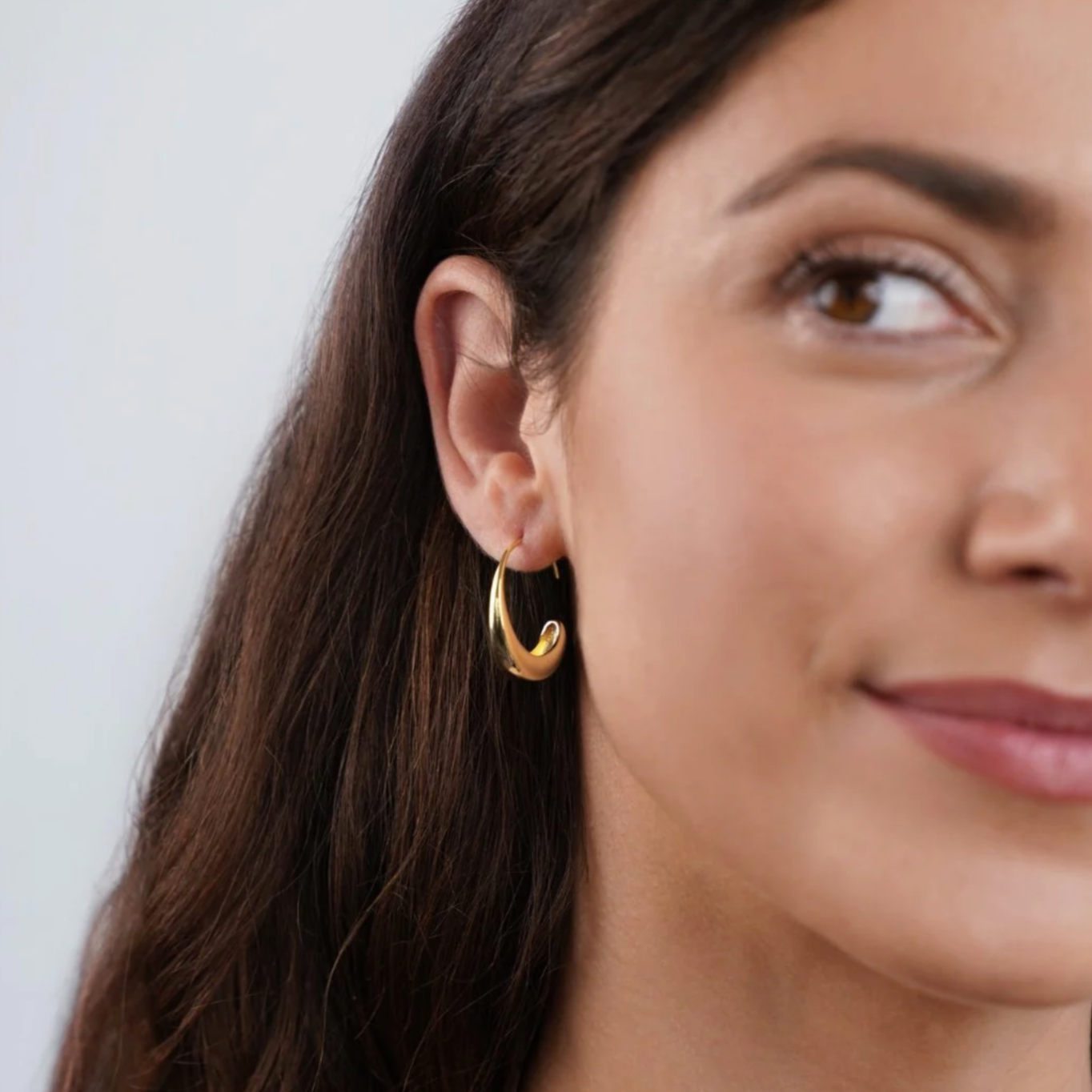 Large C form gold hoops for women
